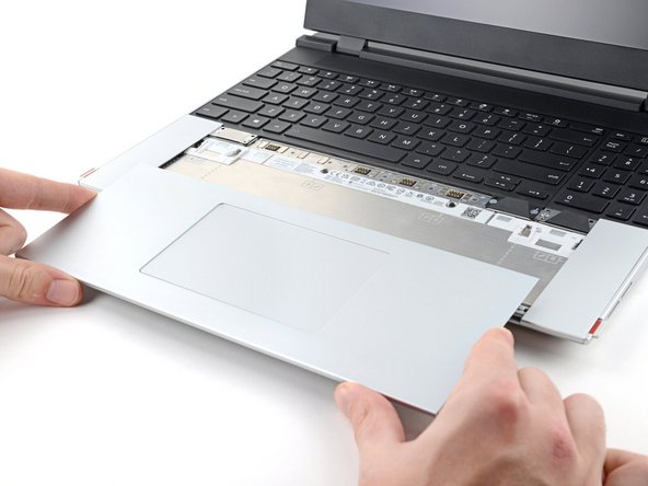 Lift the Touchpad Module and remove it.