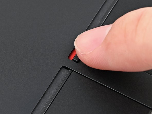 Use your finger to flip both latches and lock the rows of Expansion Cards.