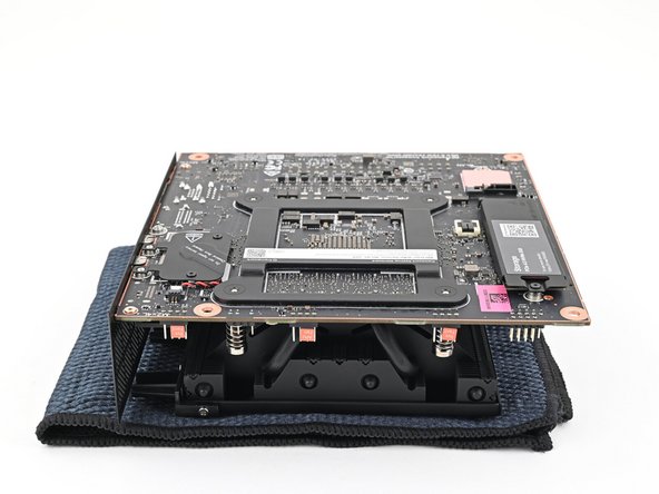 Place the Mainboard on your work surface with its heatsink resting on a soft, clean cloth.