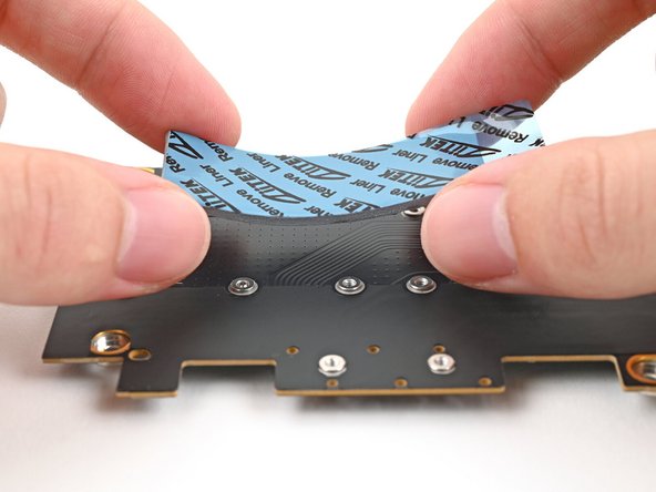 Remove the clear liner from the thermal pad labeled 1.75 mm to expose one side of it.