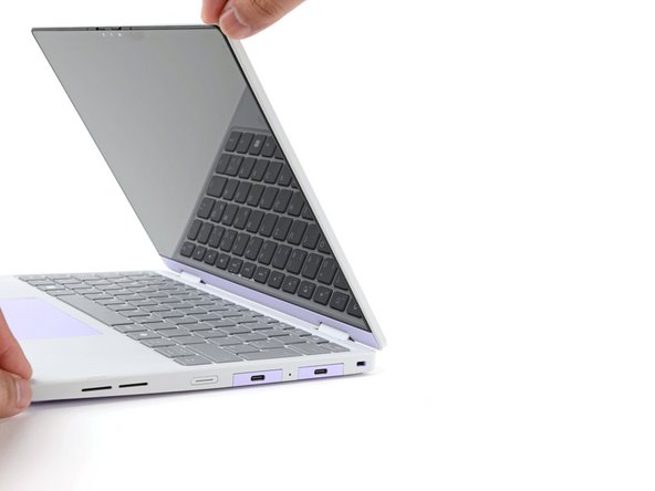 Open the laptop lid so that both the screen and the base lie flat on your work surface.