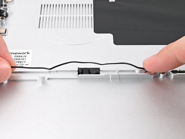 Repeat the previous two steps for the section of the speaker cable near the left Speaker.