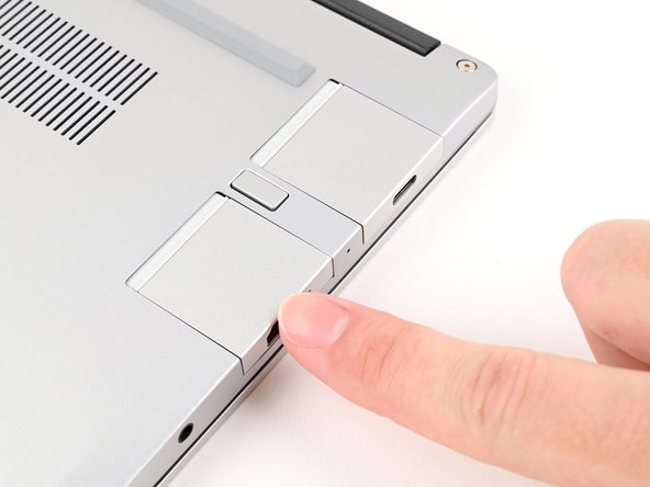 The Expansion Cards should click into place, and the front edge should be flush with the Laptop.