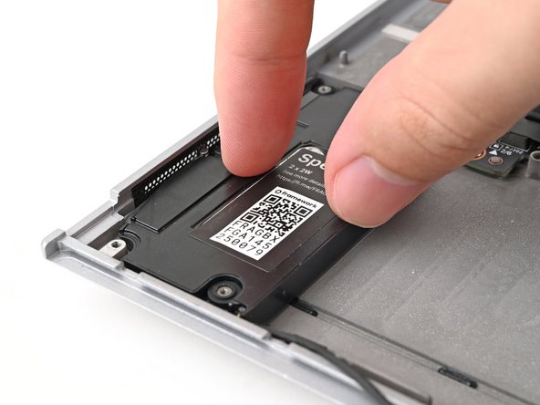 Align the speakers over their alignment pegs and press them down into place.