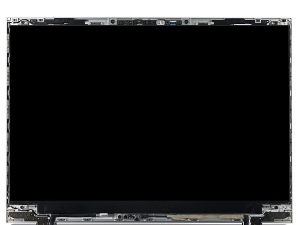 While supporting the display with one hand, use your Framework Screwdriver to install the four 2.4 mm‑long T5 Torx screws securing the display.