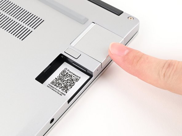 You don't need to hold down the release button to install the Expansion Cards—only when you want to remove them.