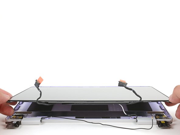 Lift and remove the display from the Top Cover.