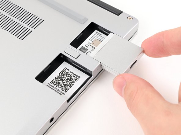 Slide an Expansion Card into an Expansion Card slot.
