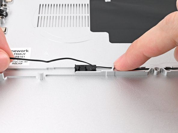 Repeat the previous two steps for the section of the speaker cable near the left Speaker.
