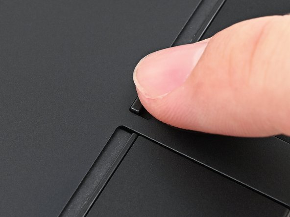 Use your finger to flip both latches and lock the rows of Expansion Cards.