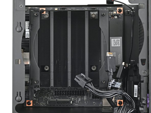 Use your Framework Desktop Screwdriver to install the four 8.2 mm‑long Phillips screws securing the Mainboard.