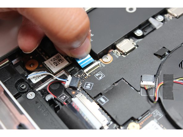 Slide the cable straight out of the connector.