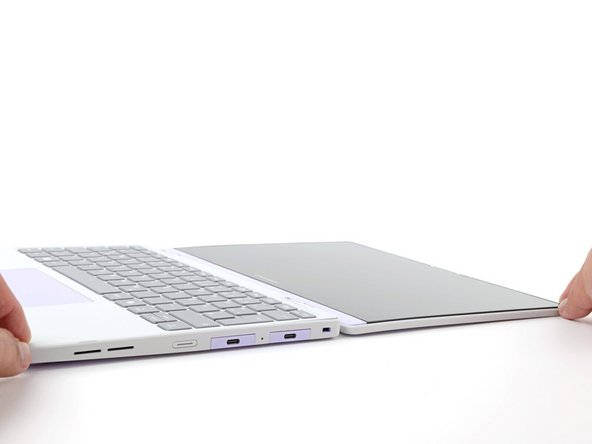 Open the laptop lid so that both the screen and the base lie flat on your work surface.