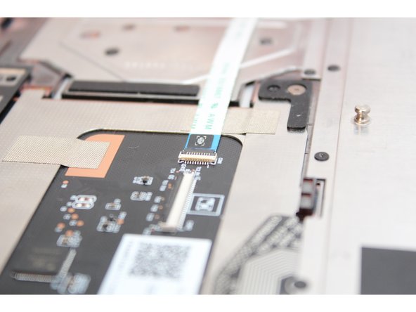 Flip the black latch down to secure the cable.