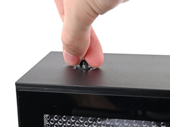 Repeat the same procedure for the other top panel screw.