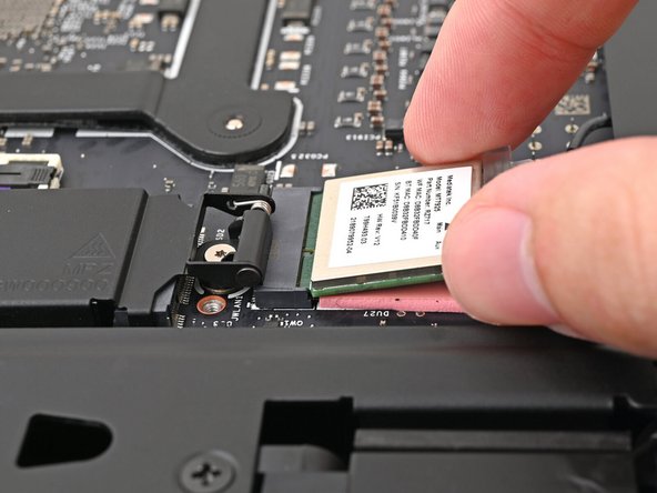 Grip the Wi-Fi module by its edges and pull it straight out of its socket.