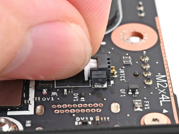 Grip the RTC battery connector and pull it straight out of its socket to disconnect it.