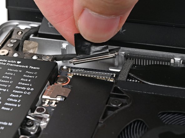 Press the Display eDP Cable connector straight down into its socket to connect it.