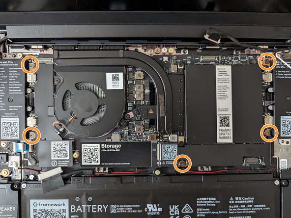 Using the T5 bit in the Framework Screwdriver, screw the five fasteners into the Mainboard once it is properly seated.