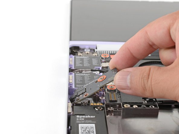 Insert the Audio Board into the laptop at an angle to help align the headphone jack.