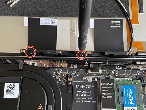 Fasten the new Antenna Module into the Top Cover using the two fasteners you removed before, using the T5 bit in the Framework Screwdriver.