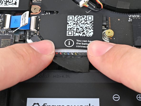 Use your fingers to align the Battery connector with its socket and slide it straight in to reconnect the Battery.