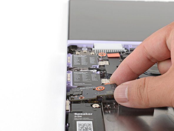 Use the two plastic alignment pins on the laptop to help with final alignment.
