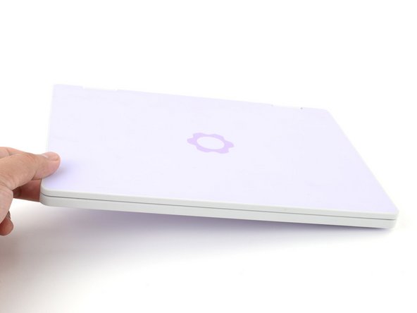 Flip your laptop face-up on your work surface.