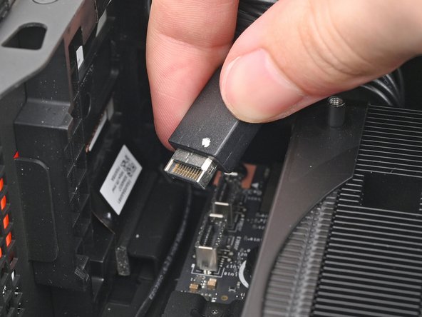 Slide the top Expansion Card cable into its socket on the Mainboard.