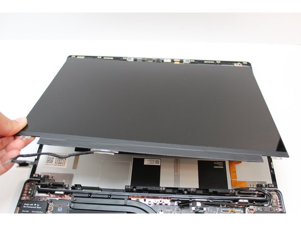 Be sure to only handle the Display by the side edges and avoid touching the bottom area.