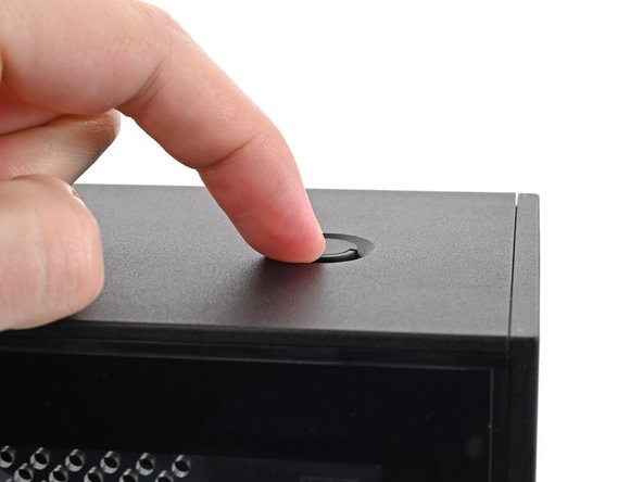 Use your finger to close the two D-rings on the top panel screws.