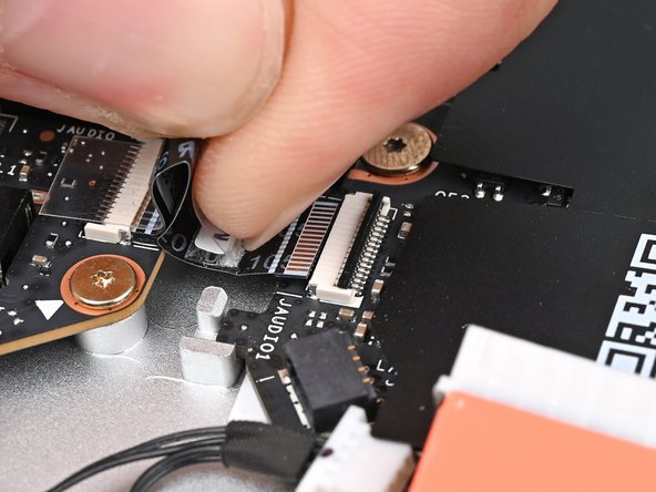 Slide the Audio Board cable straight into its socket.