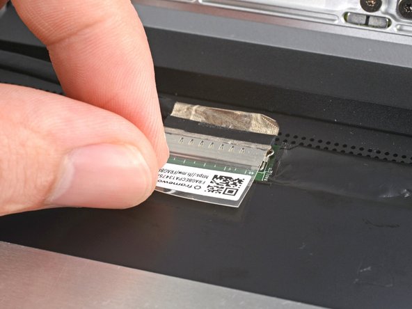 Use your fingers to flip down the plastic tab.