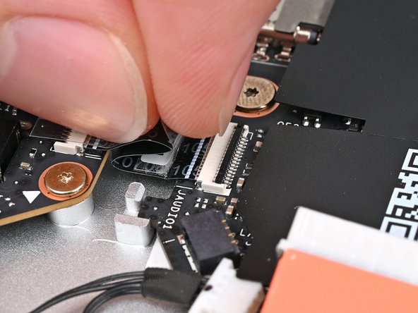 Slide the Audio Board cable straight into its socket.