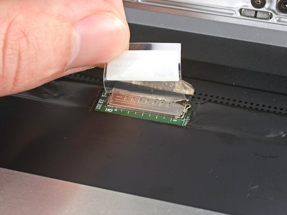 Use your fingers to flip down the plastic tab.