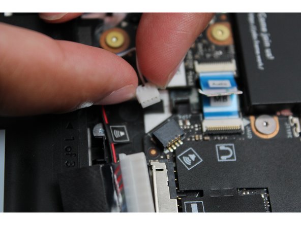 Using both fingers and a slight amount of force, disconnect the Speaker cable from the Mainboard by pulling it straight out.