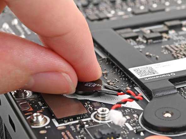 The RTC battery is lightly adhered to the Mainboard.