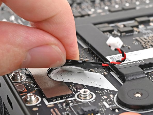Use your fingers to peel the RTC battery off the Mainboard and remove it.