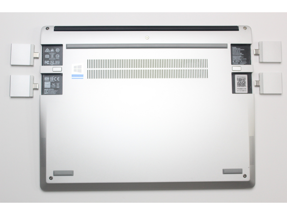 While keeping the release button pressed, use your other fingers to slide the Expansion Card away from the laptop.