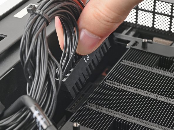 Orient the main power supply cable so its clip is facing away from the heatsink.