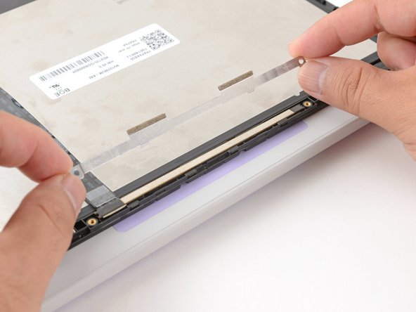 Lift and remove the webcam bracket.