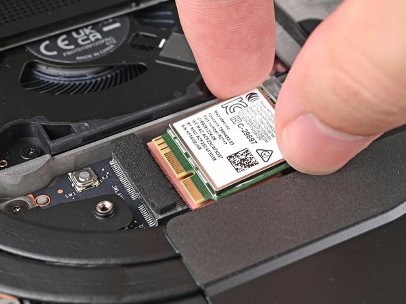 Don't pull the module too far from its socket, as it's still connected by two cables.