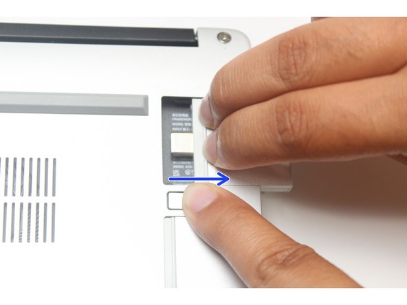 Close your laptop completely and turn it over so you can access the Expansion Cards.