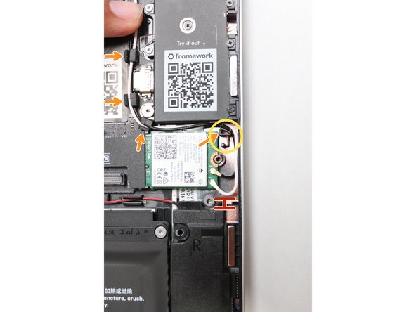 Carefully connect the black and white WiFi antenna cables into their respective sockets on the module. Make sure to align them well before applying force to click them into place, as the connectors are small and fragile.