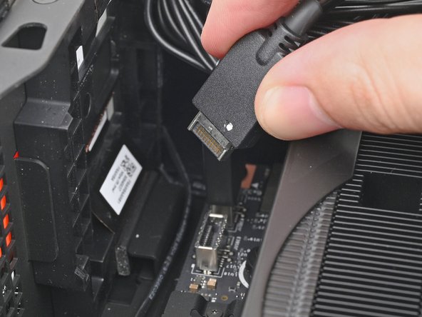 Slide the top Expansion Card cable into its socket on the Mainboard.