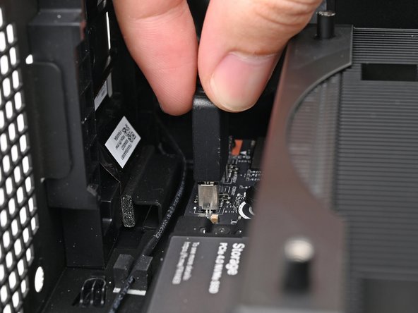Slide the bottom Expansion Card cable into its socket on the Mainboard.