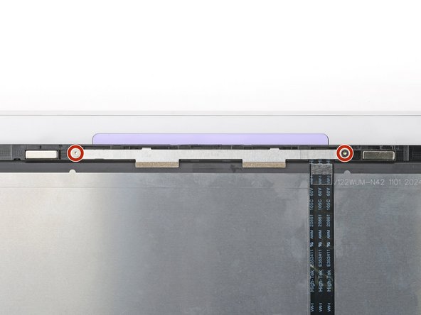 Use your Framework Screwdriver to remove the two 3.3 mm‑long T5 Torx screws securing the webcam bracket on the top edge behind the display.