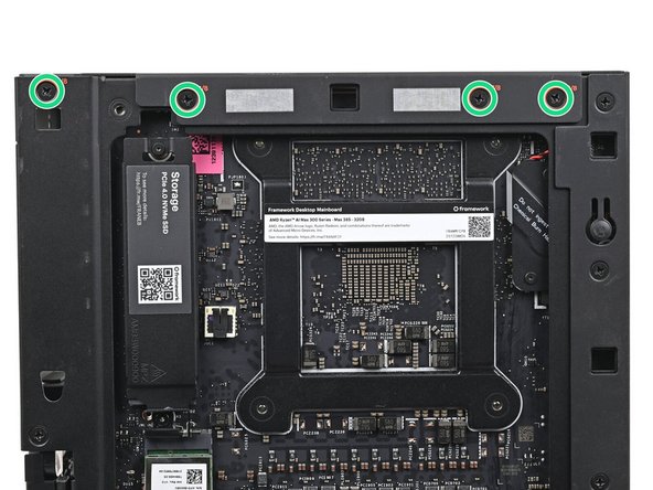 While holding the Desktop steady, use your Framework Desktop Screwdriver to install the eight 4.0 mm‑long Phillips screws securing the top plate.