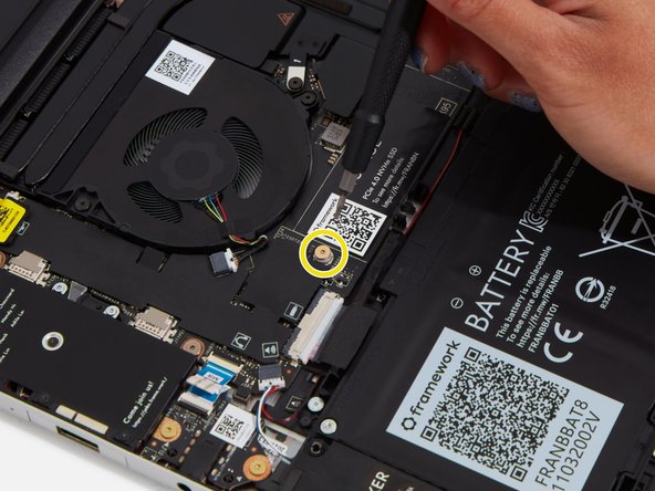 Get ready to install the Storage module by removing the fastener for it from the Mainboard using the T5 bit in your Framework Screwdriver.