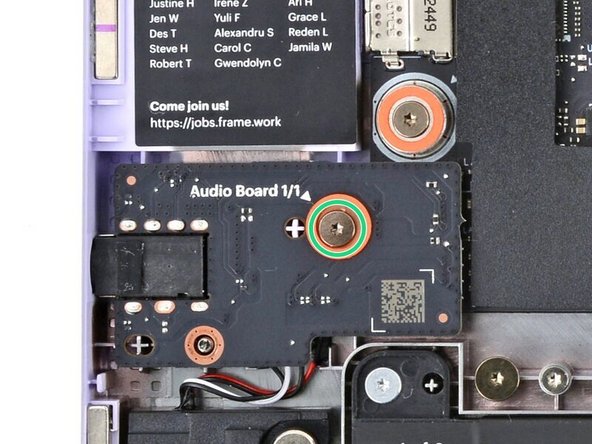 Use your Framework Screwdriver to tighten the captive T5 Torx screw to secure the Audio Board.